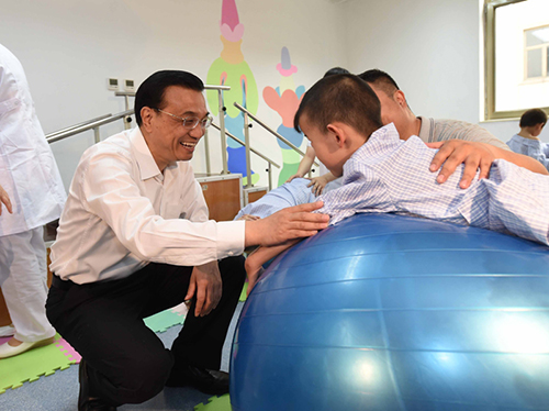 這三年，總理牽掛的殘疾人群體，迎來哪些暖政？